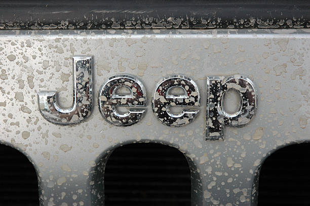Jeep name badge logo on a silver wrangler splash marks stock photo