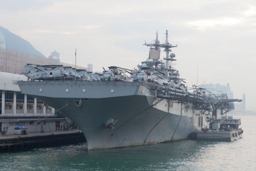 Hong Kong, China - September 1, 2011: A view of USS Boxer, a multipurpose amphibious assault ship. The USS Boxer parked at Ocean Terminal, Tsim Sha Tsui, Hong Kong. It is in Hong Kong for several days before heading back to action duties.