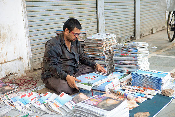 Newspaper vendor in New Delhi, India stock photo
