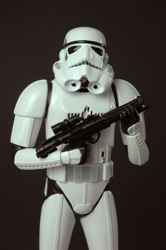 Adelaide, Australia - February 7, 2012: Star Wars Stormtrooper toy figure standing with blaster weapon. This toy figure licensed by lucas stands 13 inches tall and calls out a warning when movement is detected.