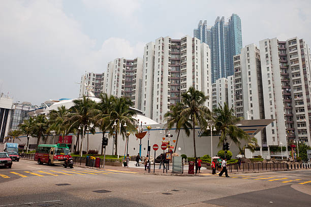 Hong Kong, China - August 31, 2011: Pedestrians walk past the Shung King Street. A a ship-shaped shopping center is a landmark in Whampoa Garden. It is located in Shung King Street, Hung Hom, Kowloon, Hong Kong. A JUSCO department store is in this shopping center.