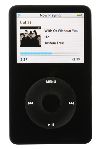 Colorado Springs, Colorado, USA - May 25, 2011: A front view of an Apple iPod playing an MP3 audio file. The music being played is With Or Without You by U2. The iPod in this photo is a fifth generation Apple iPod. This model was the first iPod with video playback capabilities.
