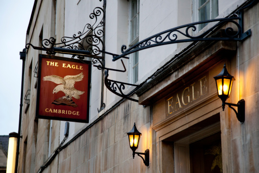 Cambridge, England - January 15, 2012: The entrance to a famous historical public house or pub called the Eagle in the centre of the university city of Cambridge in England.