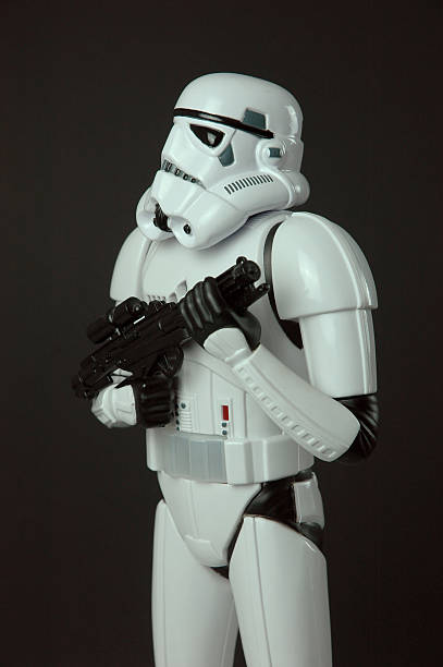 Cantonment, Fl, USA-June 1, 2015:  Clone trooper figures on white background with child's hand placing them, shot in studio, character from Star Wars film franchise created by George Lucas.