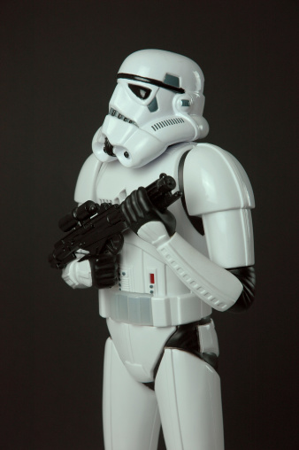 Adelaide, Australia - February 7, 2012: Star Wars Stormtrooper toy figure standing with blaster weapon. This toy figure licensed by lucas stands 13 inches tall and calls out a warning when movement is detected.
