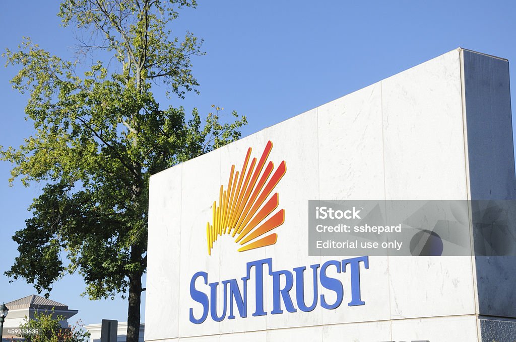 SunTrust bank sign Atlanta, Georgia, USA - August 28, 2011:  Close up of SunTrust bank sign in Atlanta, Georgia, with copy space above.  Sign located near the 100 block of Perimeter Center north of downtown. Bank - Financial Building Stock Photo