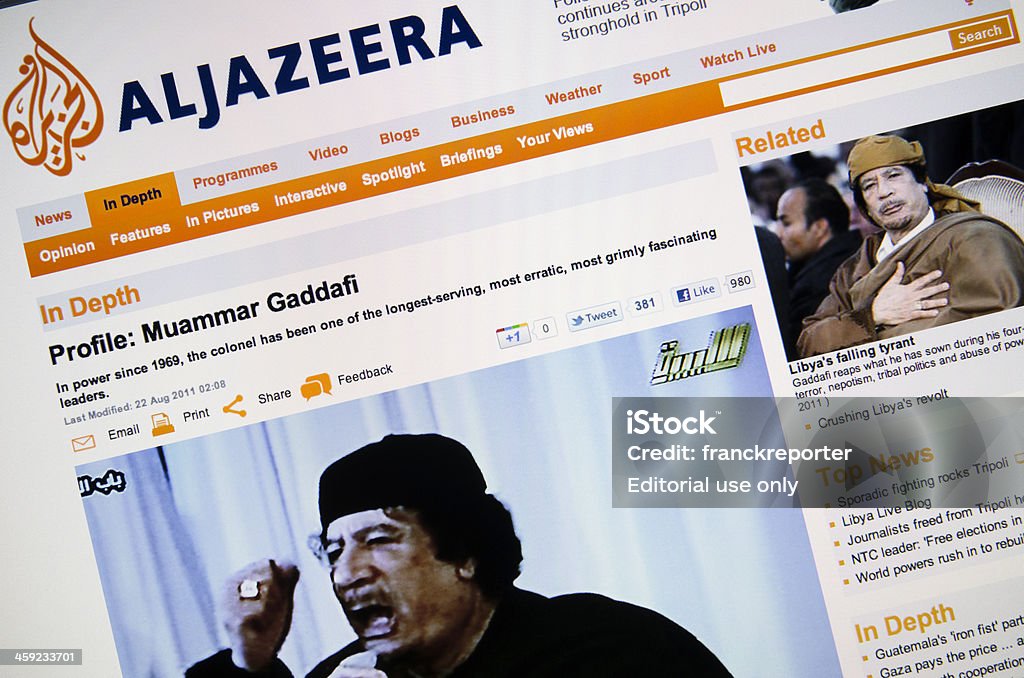 Aljazeera.com web page shows the Muammar Gheddafi profile Florence, Italy - August 24, 2011: Aljazeera.com web page shows the Muammar Gheddafi profile. Muammar Gheddafi is a Libyan militar officer sovereign in Libya. Al Jazeera Stock Photo