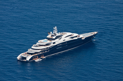 Capri, Italy - August 20, 2011: The Fincantieri mega yacht SERENE moored in a bay of the isle of Capri, Italy. The motoryacht Serene (134 mt) is the largest yacht ever built in Italy and one of the most largest yachts in the world.