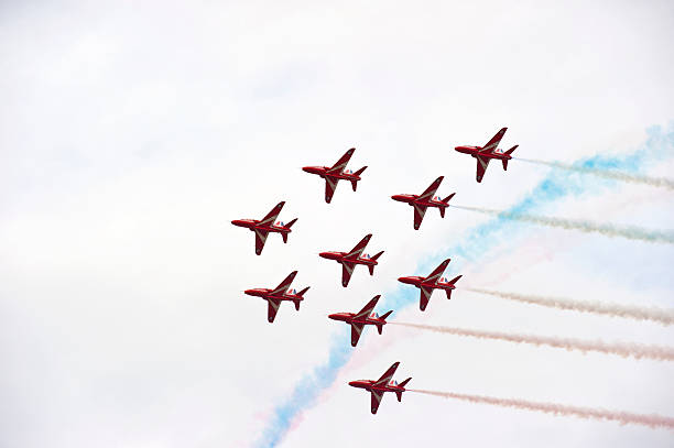 Red Arrows, Farnborough AIr Show Farnborough, England - 24th July 2010. The Royal Air Force aerobatic display team The Red Arrows perform at the Farnborough International Air-Show. british aerospace stock pictures, royalty-free photos & images