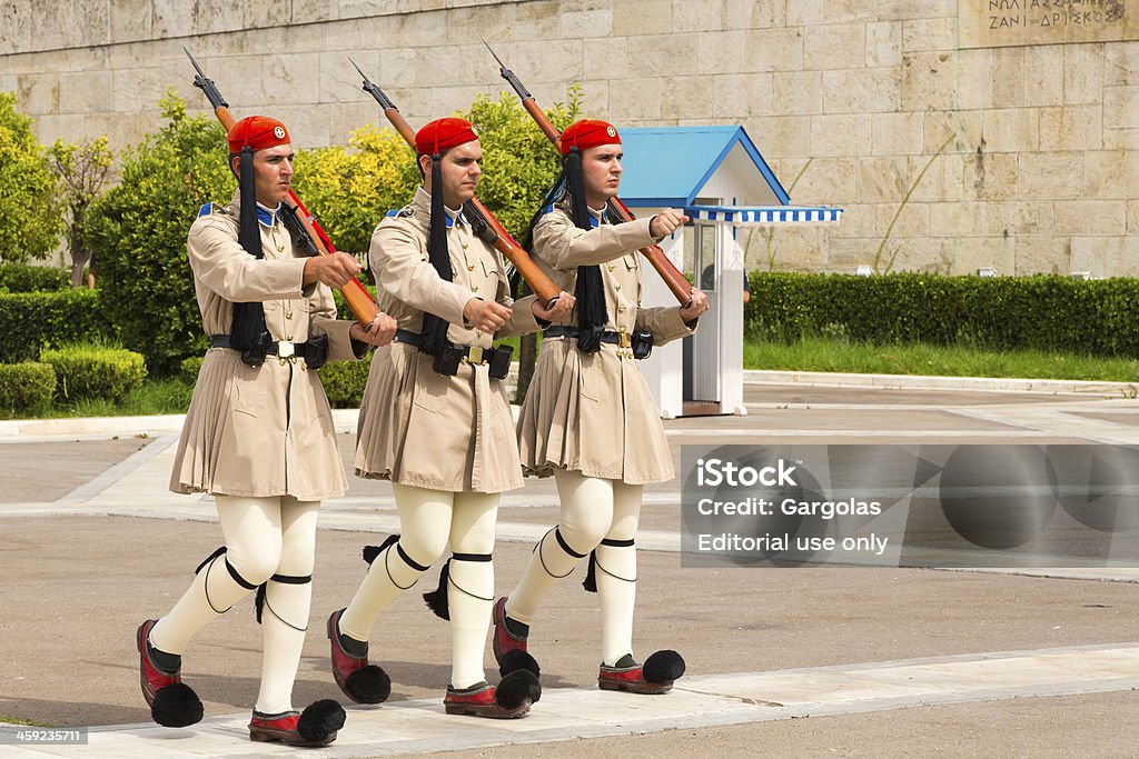 Changing of the Guard, Athens, Greece Athens, Greece - September 16, 2013: Every hour on Syntagma Square in the center of Athens, opposite the tomb of the Unknown Soldier and Parliament building, it is possible to watch the changing of the presidential guard (Evzones). This fascinating ceremony requires precision and timing of soldiers who perform. The typical clothing evzones draws attention both for its color and originality and it is composed mainly of the skirt (fustanelle), the beret silk tassel (fario) without forgetting the famous shoes with large tassels (tsarouchia) . Accuracy Stock Photo