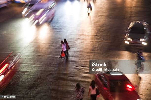Women Crossing A Mainroad In Bangkok By Night Stock Photo - Download Image Now - Adult, Adults Only, Asia