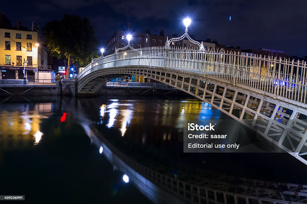 Ha'penny Bridge Dublin Ireland Dublin, Ireland - October 14, 2013: The Ha'penny Bridge on a dark night over the River Liffey in the center of Dublin. Bridge - Built Structure Stock Photo