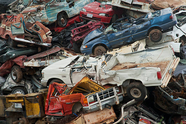 Scrap Heap Abilene, Texas USA -October 10, 2013: Outside Abilene, Texas car and trucks are piled up in a scrap heap of metal. abilene texas stock pictures, royalty-free photos & images