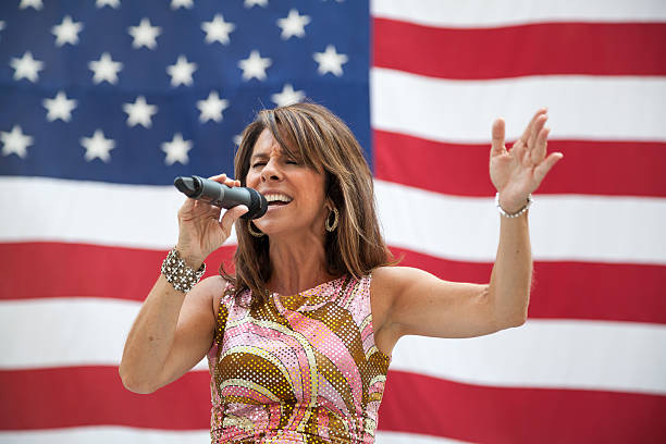 Diana Nagy Performs in Chicago Chicago, Illinois, United States - September 6, 2013: Diana Nagy performs at Daley Plaza downtown during tour presented by the American Fallen Warrior Memorial Foundation. national anthem stock pictures, royalty-free photos & images