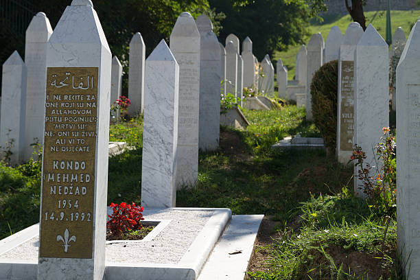 Martyr's Memorial Cemetery Kovaci In Sarajevo Sarajevo, Bosnia and Hercegovina - July 22, 2013: Cemetery For Muslims Killed During The Conflict In The Early 1990's In Sarajevo, Bosnia and Hercegovina. The Tombstones Are Facing The Opposite Direction So No Names Can Be Seen, There Are Thousands Of Markers Just Like This In The Cemetery. ethnic cleansing stock pictures, royalty-free photos & images