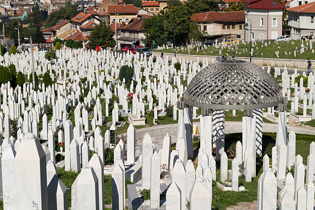 Martyr's Memorial Cemetery Kovaci In Sarajevo Sarajevo, Bosnia and Hercegovina - July 22, 2013: Cemetery For Muslims Killed During The Conflict In The Early 1990's In Sarajevo, Bosnia and Hercegovina. The Tombstones Are Facing The Opposite Direction So No Names Can Be Seen, There Are Thousands Of Markers Just Like This In The Cemetery. ethnic cleansing stock pictures, royalty-free photos & images