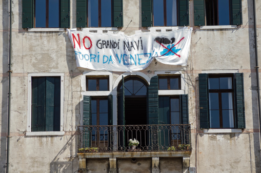 Venice, Italy - June 10 2013: Banner protesting about the damage caused by large cruise ships in Venice.