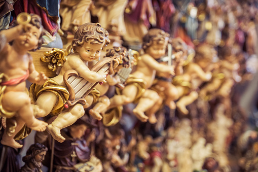 Berchtesgaden, Germany - October 12, 2013: Hand-carved wood figurines depicting traditional Bavarians through the ages. Southern Germany (Bavaria) is well-known for its wood carving and other Alpine traditions, drawing countless tourists to historic towns such as Berchtesgaden each year.