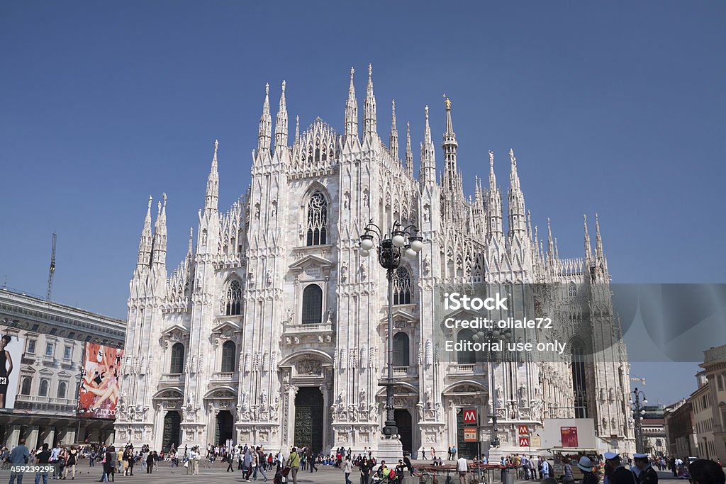 Duomo of Milan, Cathedral - Lombardia, Italy Milan, Italy - April 14, 2009: view of the Piazza del Duomo in Milan during a sunny day with tourists and people walking Architectural Dome Stock Photo