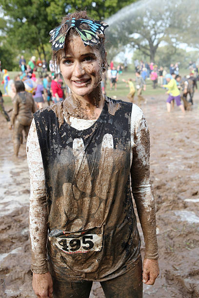 Female excited at Mud Run 2013 stock photo