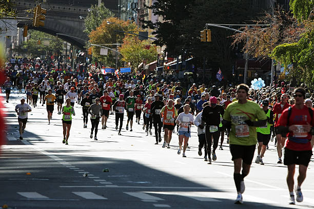 New York City Marathon New York City, USA - November 07, 2010: Athletes  running during the 2010 ING New York City Marathon. distance running stock pictures, royalty-free photos & images