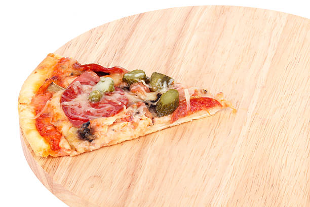 istock Slice of pizza on wooden cutting board 459243089