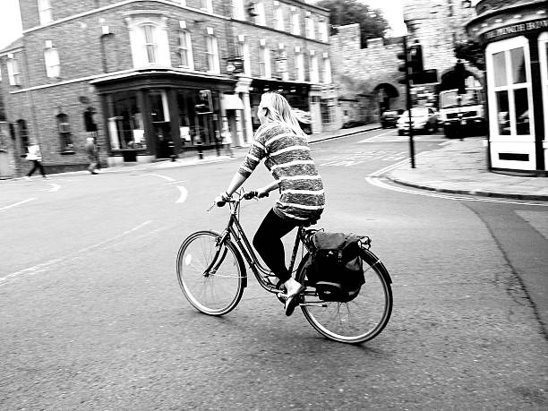Girl rides on bike stock photo