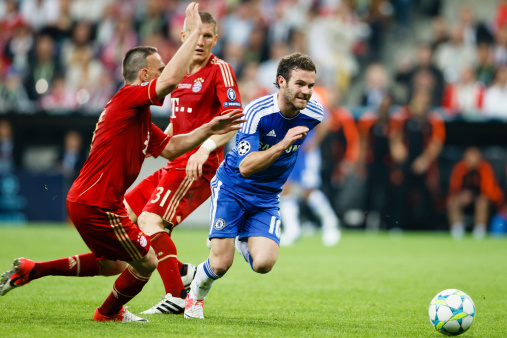 Munich, Germany - May 19, 2012: Juan Mata of Chelsea (r), Bastian Schweinsteiger (m) and Franck Ribey (l) of Bayern during FC Bayern Munich vs. Chelsea FC UEFA Champions League Final game at Allianz Arena on May 19, 2012 in Munich, Germany.