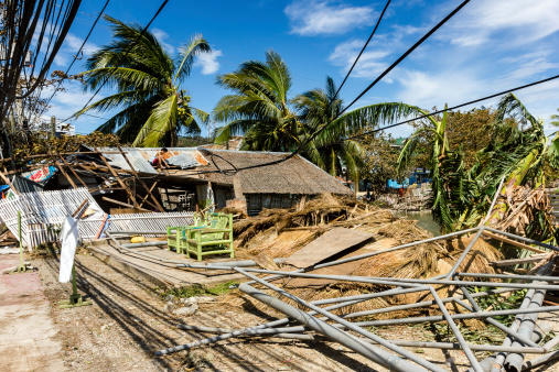 BORACAY, PHILIPPINES - NOVEMBER 9 2013:  A wooden building is reduced to nothing more than a pile of rubble by Super Typhoon Haiyan.  Haiyan, also called Yolanda was one of the strongest storms ever recorded to hit land