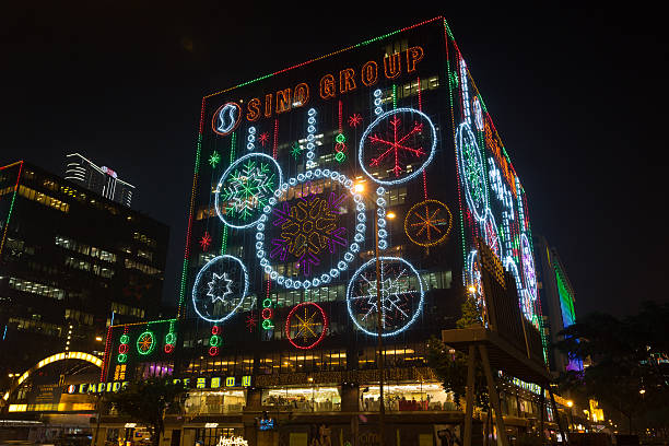 Hong Kong, China - November 8, 2013: People at Tsim Sha Tsui District. The Christmas lights are up on Hong Kong's buildings every year. This photo was taken at Mody Road, Tsim Sha Tsui, Kowloon, Hong Kong.