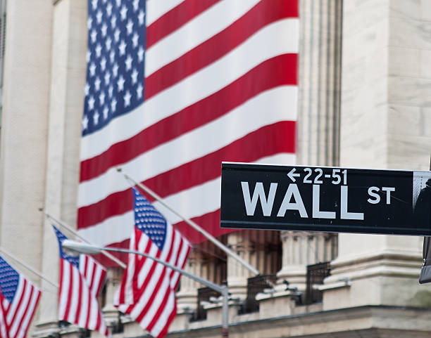 istock Wall Street Sign with US Flag Behind 459246945