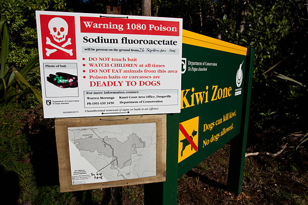 NEW ZEALAND 1080 POSION WARNING SIGN "Waipaua, New Zealand- January 22,2012: Sign warning of 1080 poison in New Zealand." possum nz stock pictures, royalty-free photos & images