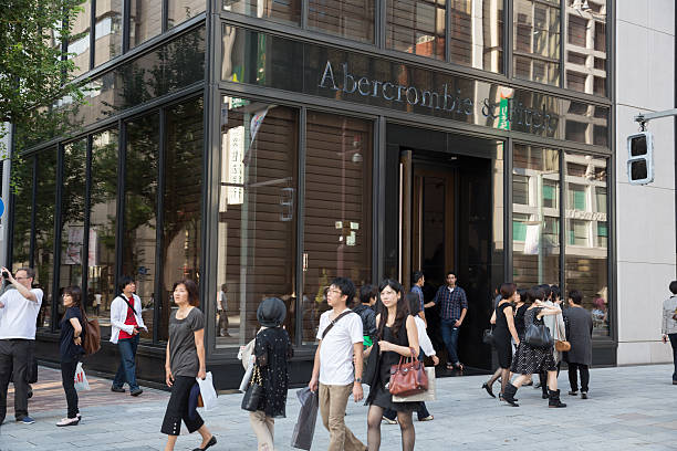 Abercrombie & Fitch in Tokyo, Japan "Tokyo, Japan - September 29, 2012 : Pedestrians walk past Abercrombie & Fitch clothing store. It is located in 6-9-10 Ginza, Chuo-ku, Tokyo, Japan. It is an American casual wear retailer." abercrombie fitch stock pictures, royalty-free photos & images