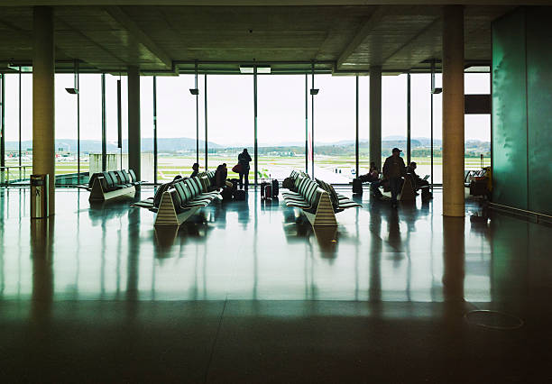 Zurich, Switzerland - November 7, 2012: Passengers waiting for flights in departure hall in Zurich Airport.