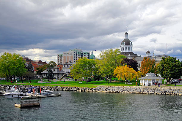 Kingston Waterfront "Kingston, A!anada - October 13, 2012: Kingston Waterfront with landmarks such as the City Hall Building, marina, park, hotels, restaurants and people." kingston harbour stock pictures, royalty-free photos & images