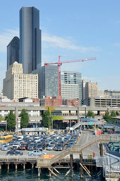 Seattle Waterfront "Seattle, USA - September 8, 2011: Tourists, residents, commuters waiting to board a ferry, people from all walks of life are seen here at the Seattle waterfront on a beautiful day." ferry terminal audio stock pictures, royalty-free photos & images