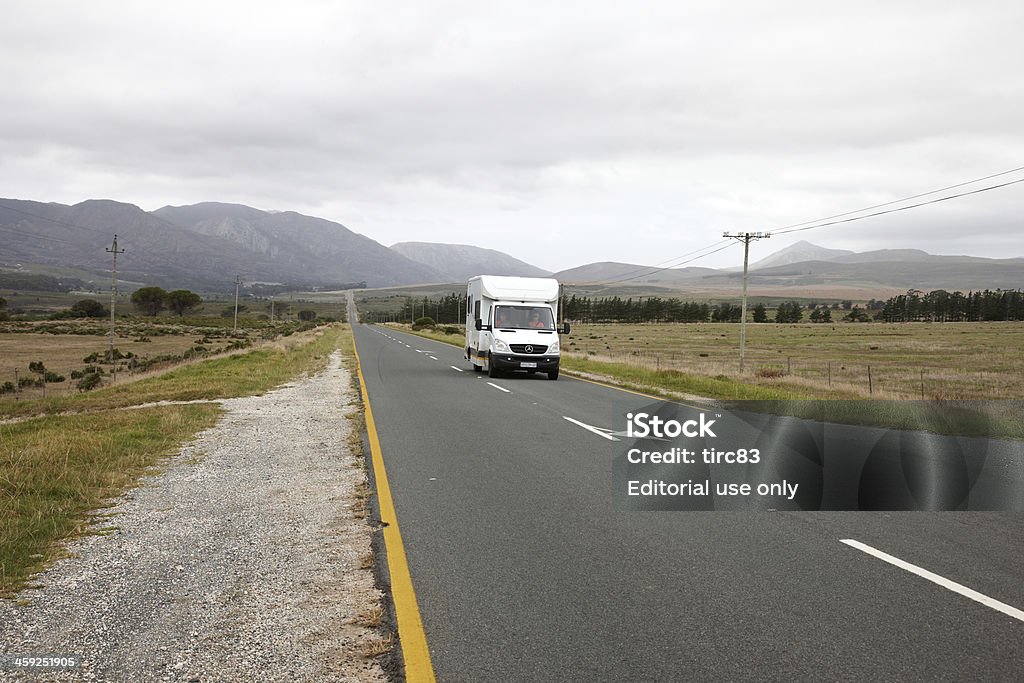 Motorhome on South African country road "Mossel Bay, South Africa - February 7, 2012:  Traffic on South African country road. motorhome heading north towards Oudtshoorn in the Western Cape region. A couple are clearly visible through the vehicle windshield" Motor Home Stock Photo