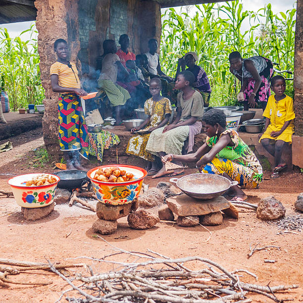 Kartiak,Senegal-September 18,2012 :African boy prays before eating.The region of Casamance, south of Senegal, the poorest part of the Country and the rate of poverty is classified very tall