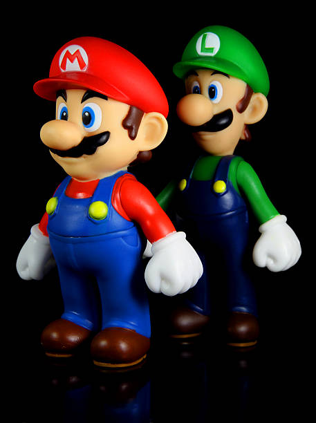 Brothers on Black "Vancouver, Canada - October 4, 2012: Luigi and Mario from the Nintendo Super Mario franchise of games, posed against a black background. The toys are from Banpresto Company." named animal stock pictures, royalty-free photos & images