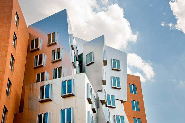 Stata Center on MIT Campus in Cambridge, Massachustets "Cambridge, USA - June 23, 2012: The Ray and Maria Stata Center for Computer, Information and Intelligence Sciences is built on the site of the legendary Building 20, constructed during World War II, that served as birth site for some of the  great ideas originated on MIT. It is designed bt the renowned architect Frank O. Gehry. The idea behind the unusual design was to carry on Building 20's innovative spirit, and to foster collaboration across many disciplines." cambridge massachusetts stock pictures, royalty-free photos & images