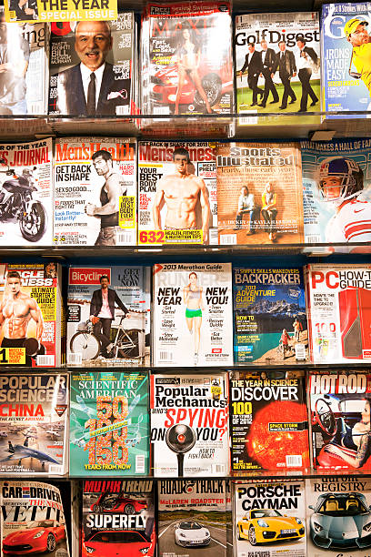 Stack of magazines # 4 XXXL "New York City, USA - December 17, 2012: Stack of popular magazines for men on the outside of the street side newsstand on Broadway Upper West." newspaper titles stock pictures, royalty-free photos & images