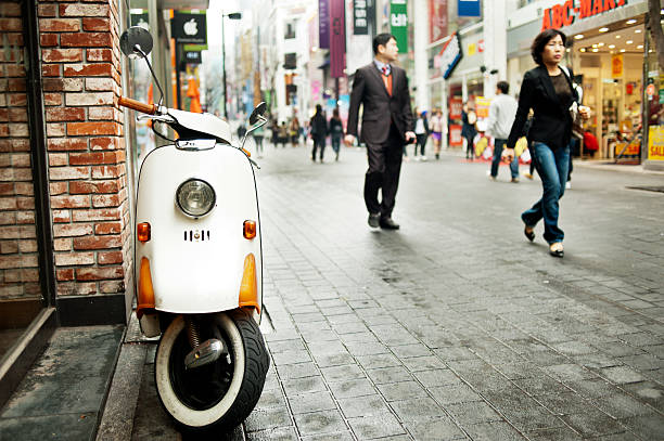 Seoul, South Korea - April 10, 2012: Street scene in Seoul, South Korea, featuring a small motorcycle - a very popular means of transportaton in the city.