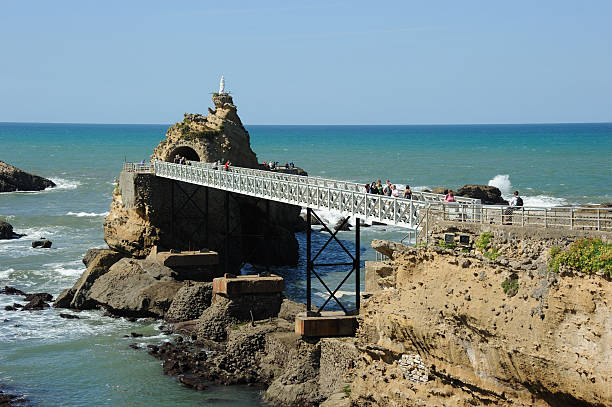 rock of the blessed virgin in biarritz - rocher de la vierge stock-fotos und bilder