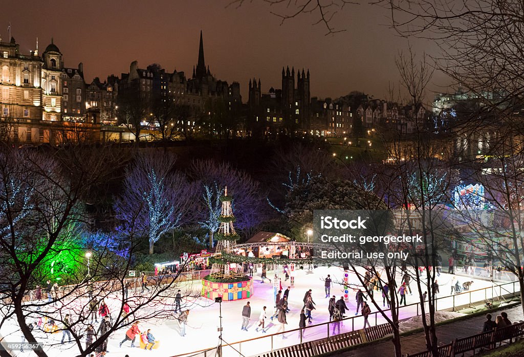 Winter Skating in Edinburgh Edinburgh, UK - December 17, 2012: People skating on a temporary ice rink in Princes Street Gardens, part of Edinburgh's winter celebrations. Ice Rink Stock Photo