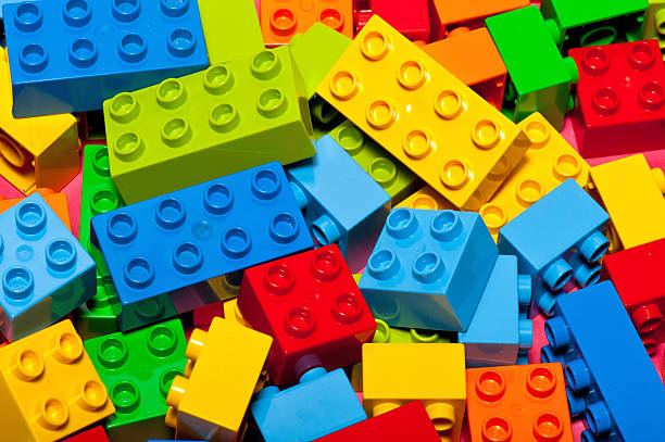 Lego Building Bricks and Blocks "Albuquerque, USA - October 13, 2012: DUPLO bricks are Lego product for youg children, age 1 and up. They are twice the length, height and width of traditional Lego bricks. DUPLO bricks encourage hands-on, minds-on exploration of young childern." lego stock pictures, royalty-free photos & images