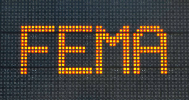 FEMA Information Sign for Hurricane Victims "Beach Haven, New Jersey, USA - December 1, 2012: A large, temporary, illuminated, flashing, FEMA (Federal Emergency Management Assistance) sign in Beach Haven, Long Beach Island, New Jersey, directing victims of Hurricane Sandy to a local Disaster Relief Center." superstorm stock pictures, royalty-free photos & images