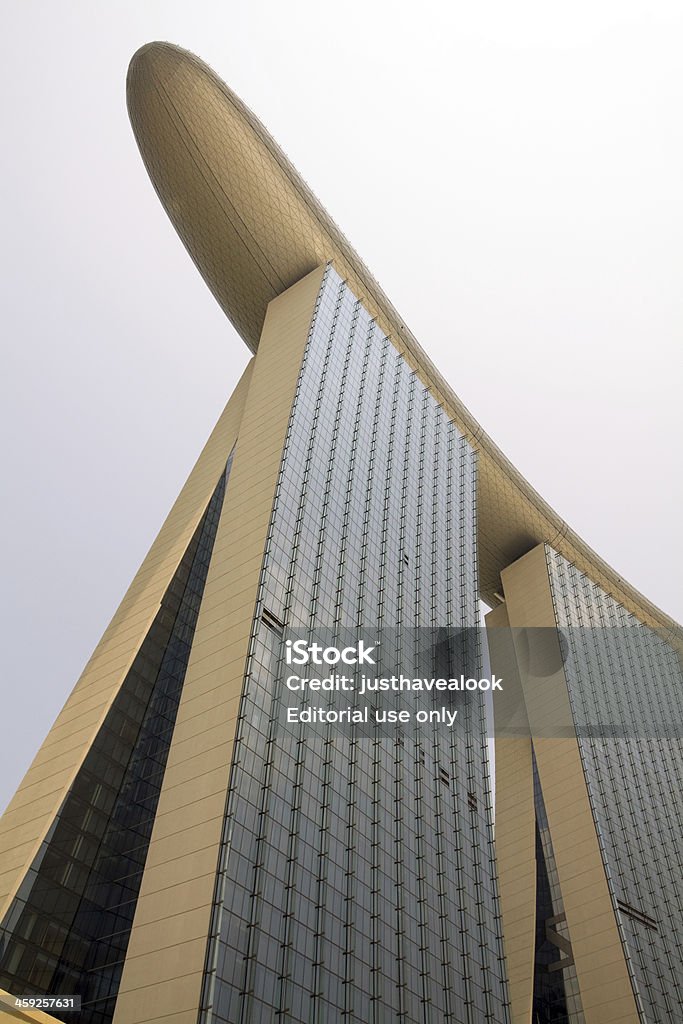 From bottom to top of Marina Bay Sands "Singapore, Singapore - September, 3rd 2012: View up to roof and terrace of famous hotel and casino Marina Bay Sands standing at Bayfront in Singapore. Building 200 meters heigh and 340 meters wide. Terrace can be visited with admission fee." Architecture Stock Photo