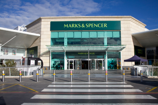 Bournemouth, England - October 15th 2012: Marks and Spencer Superstore on a bright sunny autumn morning before the crowds arrive at Castlepoint shopping centre, Bournemouth. Marks and Spencer is AKA M&S or Marks and Sparks and specialises in selling clothing and luxury foods.