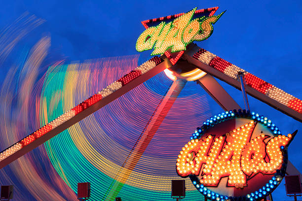 This image showcases intricately designed neon lights intertwined with rope, set against a deep blue sky that enhances the overall captivating atmosphere of the artwork.