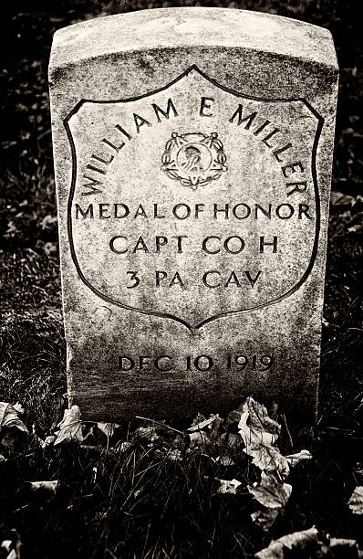 Gettysburg National Cemetery WWI Soldier Headstone, Pennsylvania USA "Gettysburg Pennsylvania, USA - November 15, 2012: A headstone of a WWI Medal of Honor Award winning soldier seen at Gettysburg National Cemetery, Pennsylvania." gettysburg national cemetery stock pictures, royalty-free photos & images